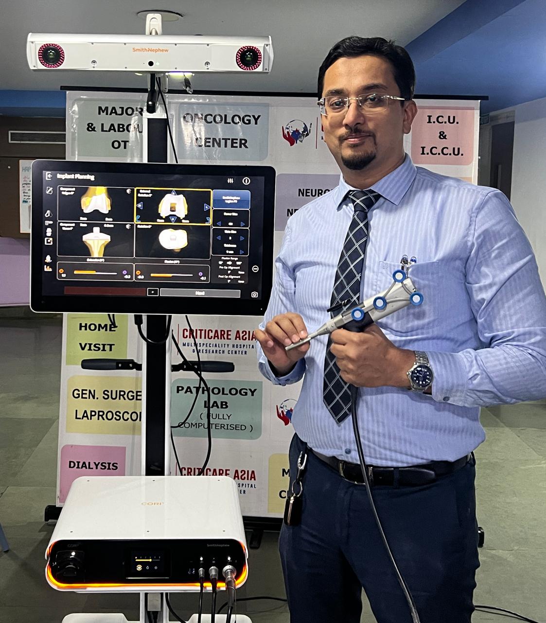 Dr. Fahad M. Shaikh with CORI-2 Smith & Nephew Robot